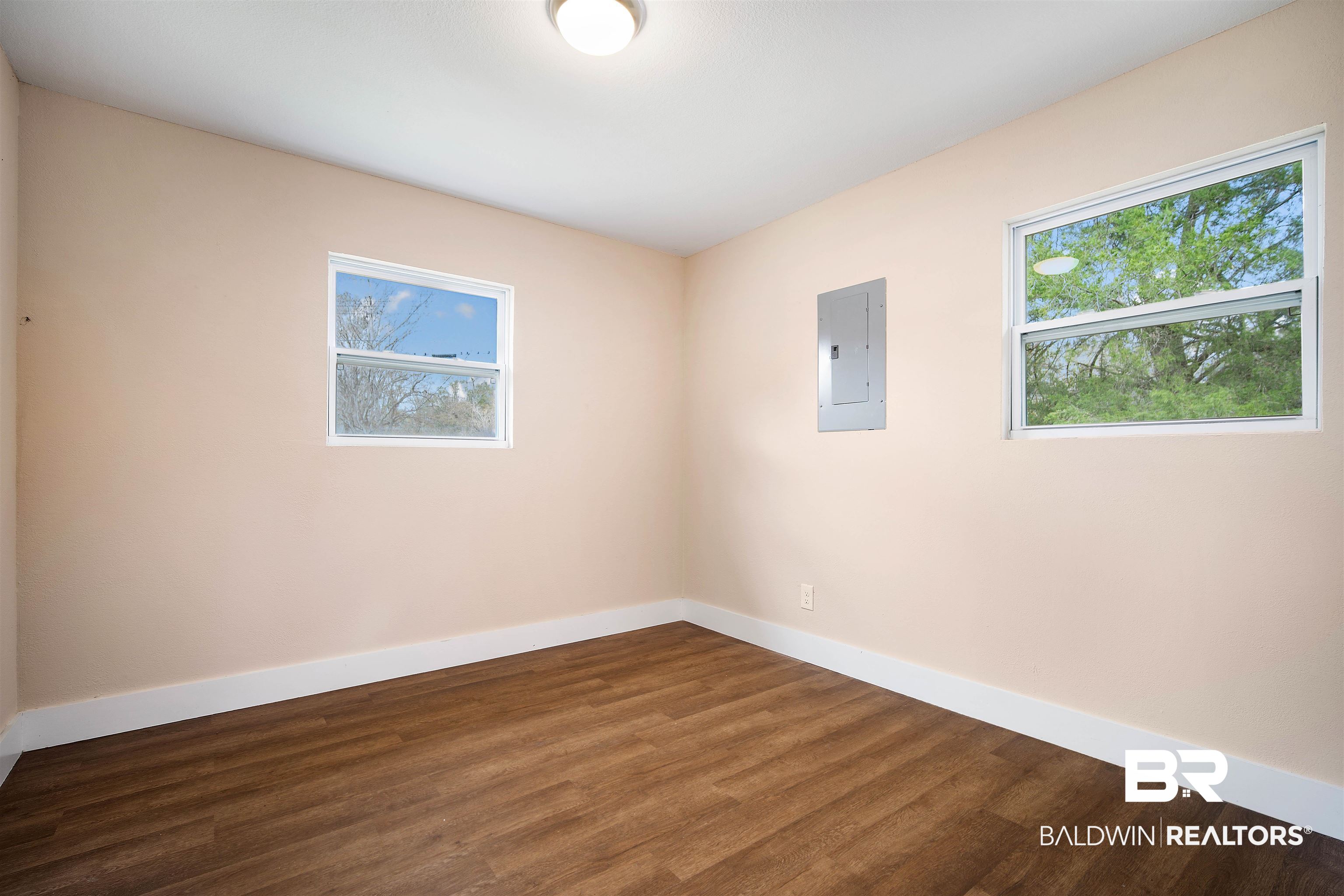 2119 Autrey Avenue Eight Mile, AL 36613 - Photo 14 of 22 Unfurnished room featuring dark wood-type flooring and electric panel