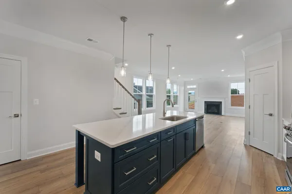 a kitchen with a sink and center island