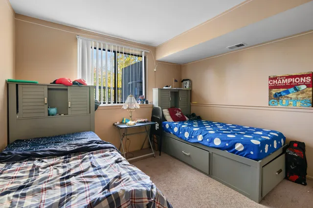 a bedroom with bed and a window