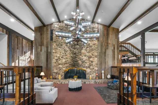 a lobby with furniture and a chandelier