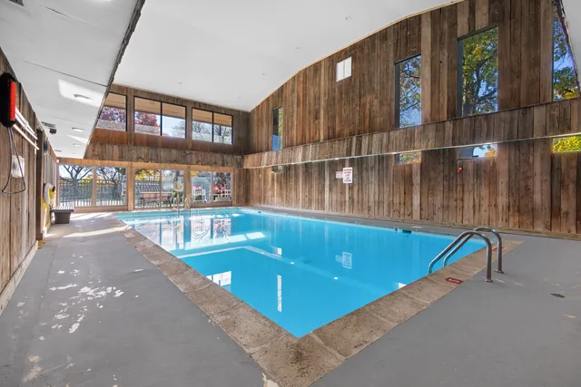 a view of swimming pool with seating space