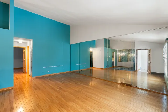a view of an empty room with glass door