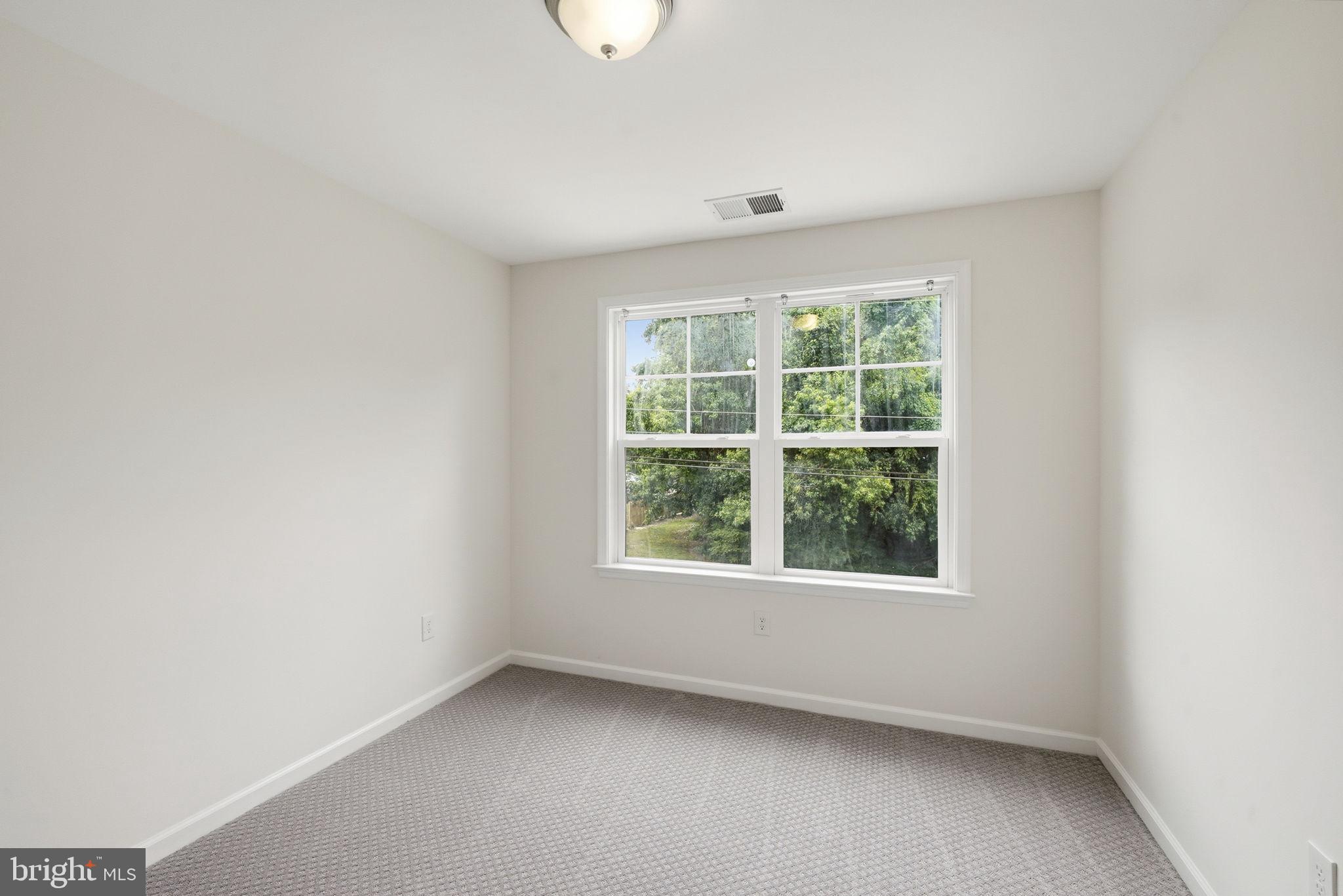 124 Riverside Drive Chester, MD 21619 - Photo 29 of 44 Bedroom 3 Bright and airy room with nature views.
