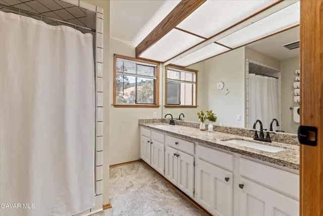 a bath tub sitting in a bathroom next to a window