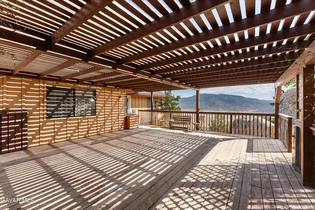 a view of a balcony with furniture