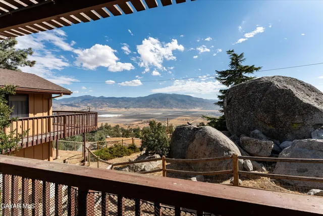 a view of a backyard with wooden floor