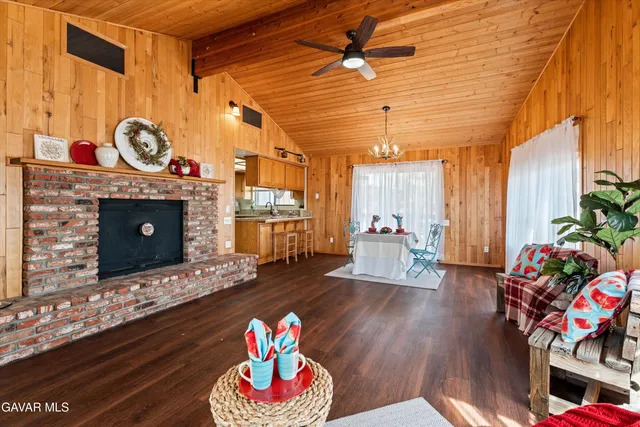a view of a livingroom with furniture window and wooden floor