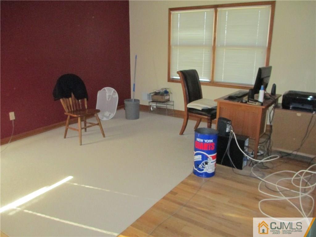 907 New Dover Road Edison, NJ 08820 - Photo 16 of 21 a view of a workspace with furniture and a window