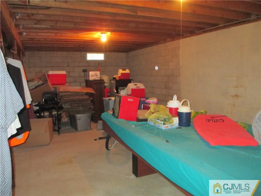 907 New Dover Road Edison, NJ 08820 - Photo 21 of 21 a room with lots of storage and utility