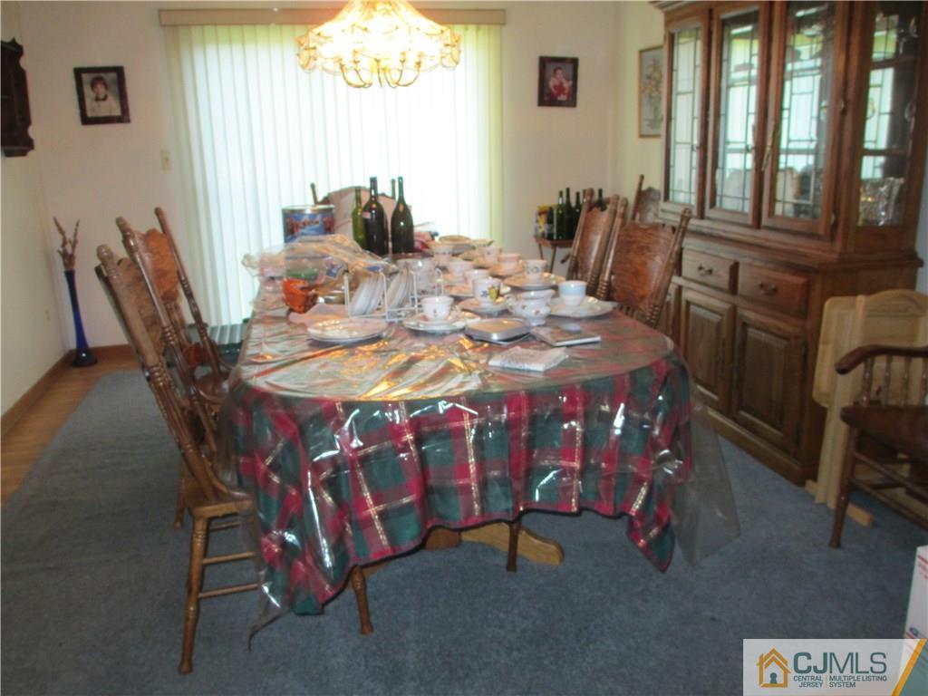 907 New Dover Road Edison, NJ 08820 - Photo 7 of 21 a dining room with furniture and window
