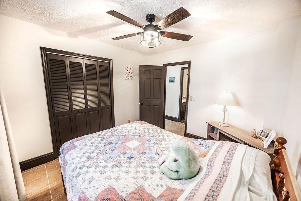1006 Chestnut Cove Trail Jasper, GA 30143 - Photo 11 of 33 a bedroom with a bed and a dresser