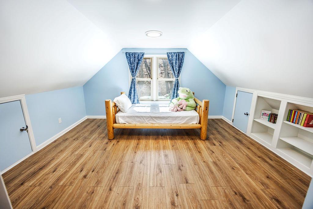 1006 Chestnut Cove Trail Jasper, GA 30143 - Photo 21 of 33 a view of bedroom with a bed and wooden floor