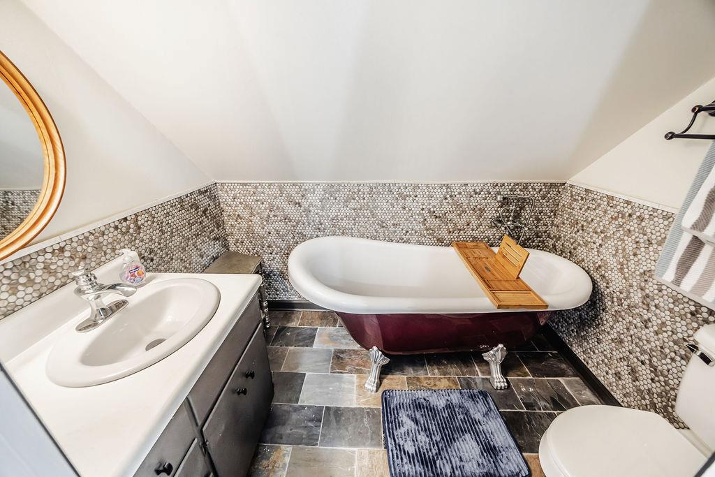 1006 Chestnut Cove Trail Jasper, GA 30143 - Photo 23 of 33 a bathroom with a sink mirror vanity and toilet