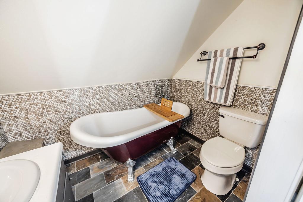 1006 Chestnut Cove Trail Jasper, GA 30143 - Photo 24 of 33 a bathroom with a toilet and a mirror