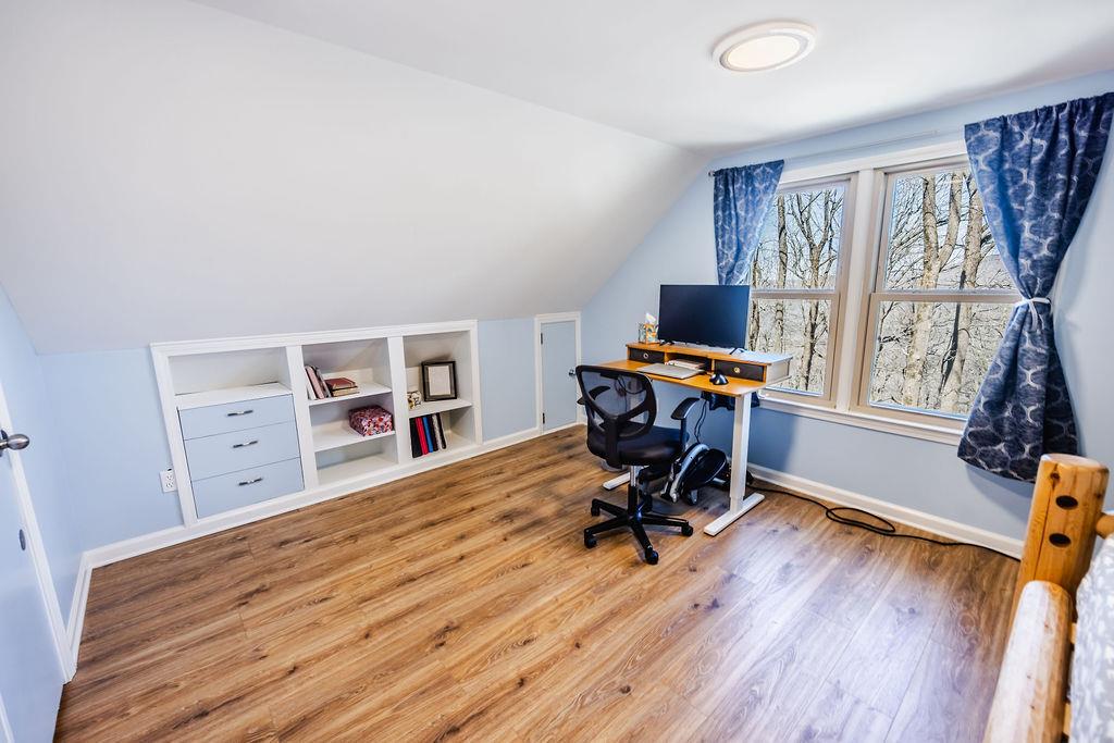 1006 Chestnut Cove Trail Jasper, GA 30143 - Photo 25 of 33 a view of a workspace with furniture and a window