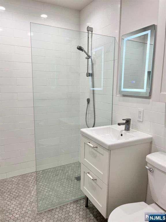 678 Grove Street Ridgewood, NJ 07450 - Photo 6 of 14 a bathroom with a sink toilet and shower
