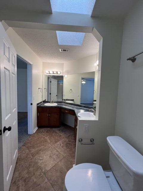 5 Neptune Drive Mary Esther, FL 32569 - Photo 17 of 32 a bathroom with a toilet a sink and a mirror