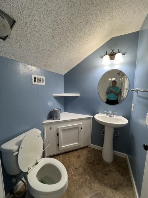 5 Neptune Drive Mary Esther, FL 32569 - Photo 23 of 32 a bathroom with a toilet a sink and a mirror