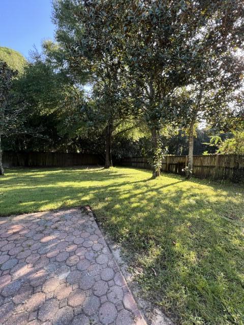 5 Neptune Drive Mary Esther, FL 32569 - Photo 27 of 32 a view of a swimming pool and a yard