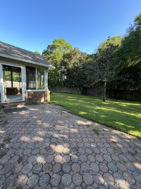 5 Neptune Drive Mary Esther, FL 32569 - Photo 28 of 32 a view of a house with a backyard and a garden