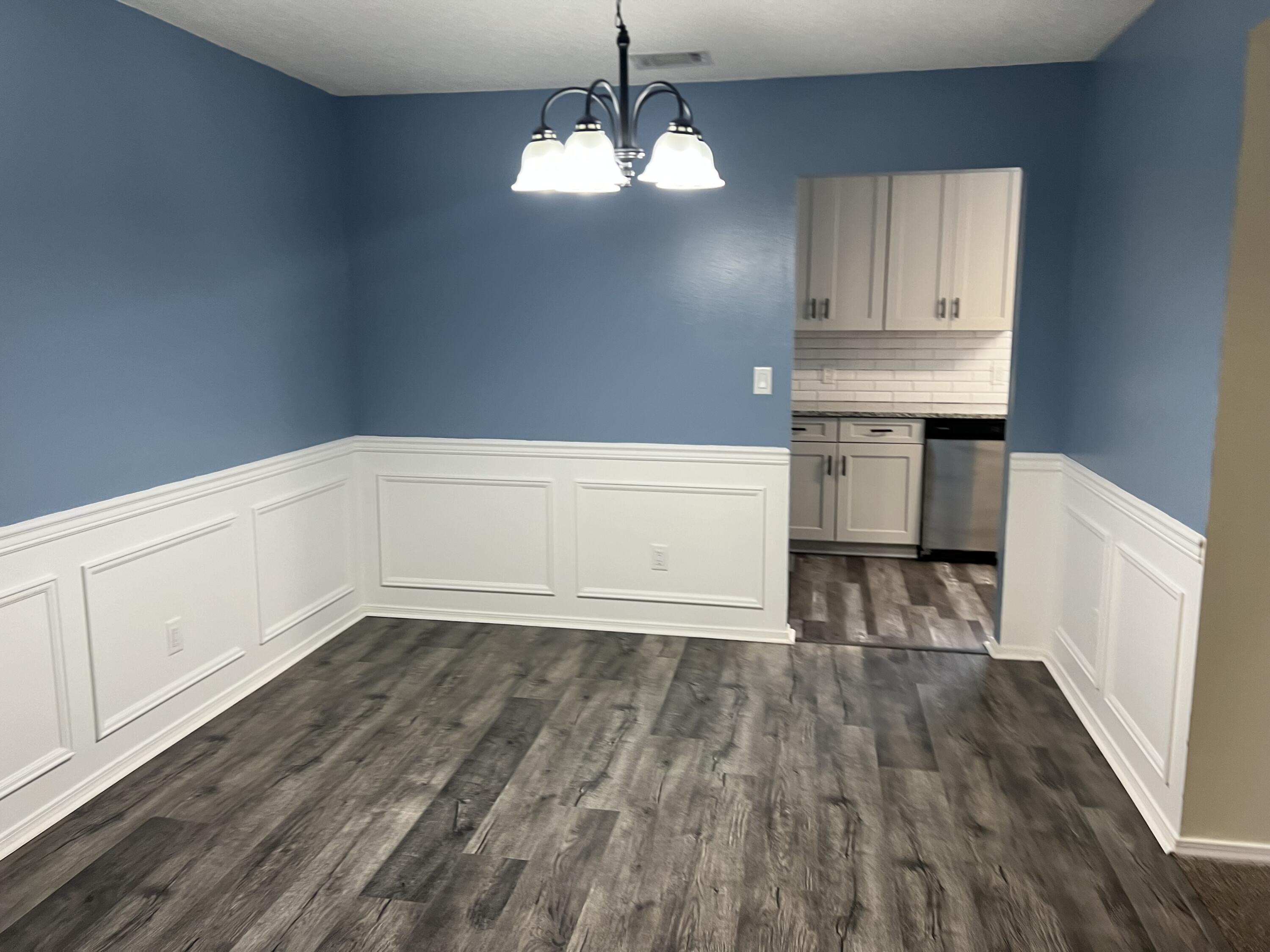 5 Neptune Drive Mary Esther, FL 32569 - Photo 5 of 32 a view of empty room with wooden floor and fan