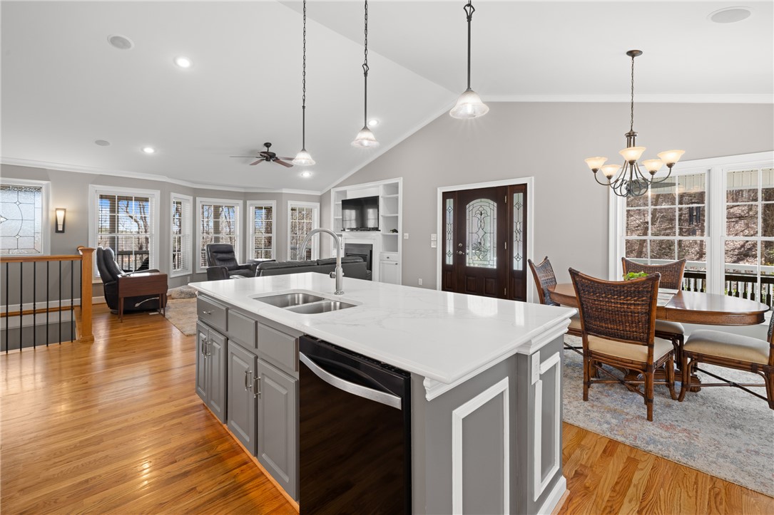 204 Riverlake Road Fair Play, SC 29643 - Photo 11 of 50 This open concept living space features a modern kitchen island and elegant hardwood flooring.
