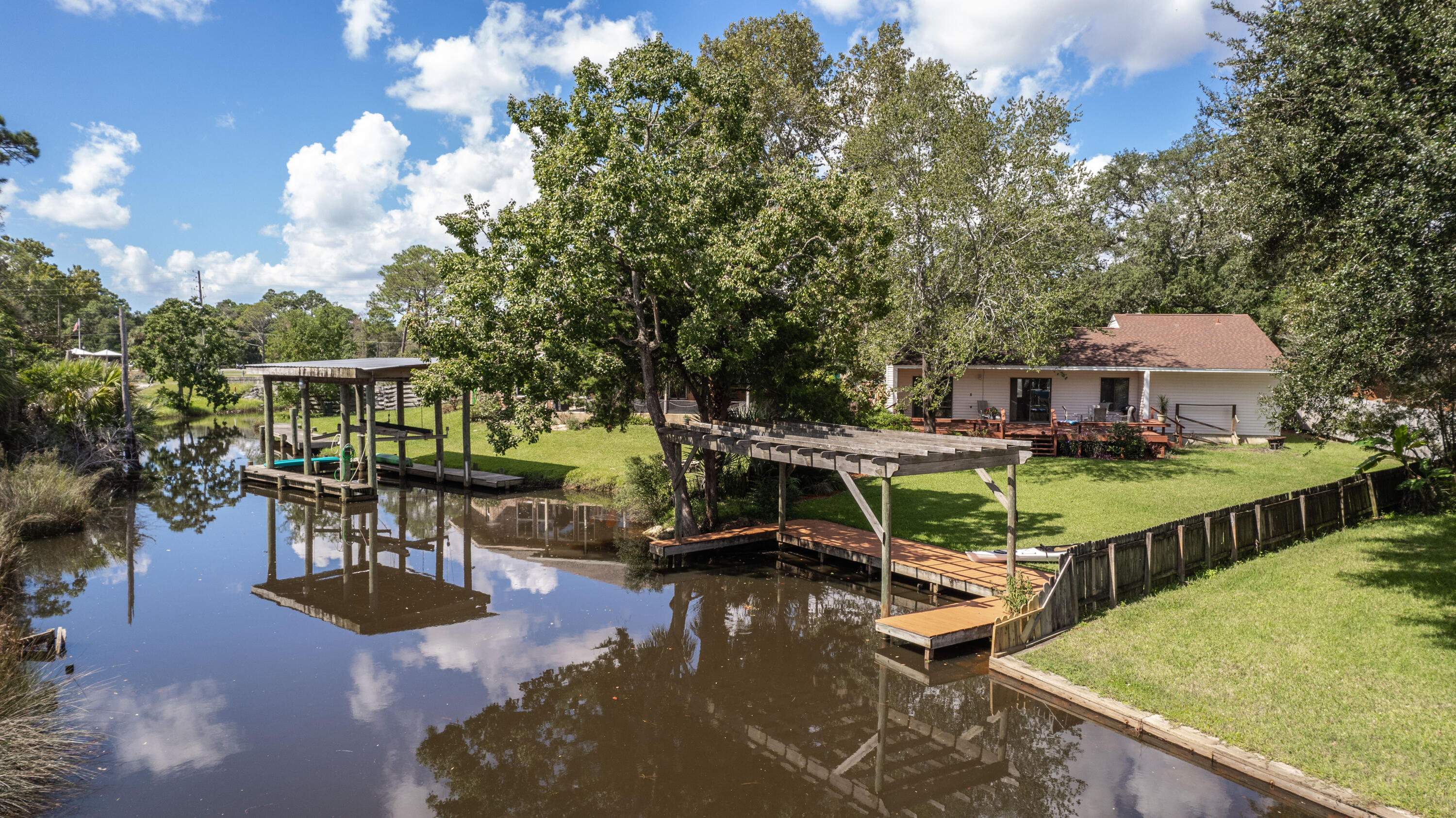 61 Ferry Road Northeast Fort Walton Beach, FL 32548 - Photo 2 of 67 61 Ferry Rd-canal view with dock