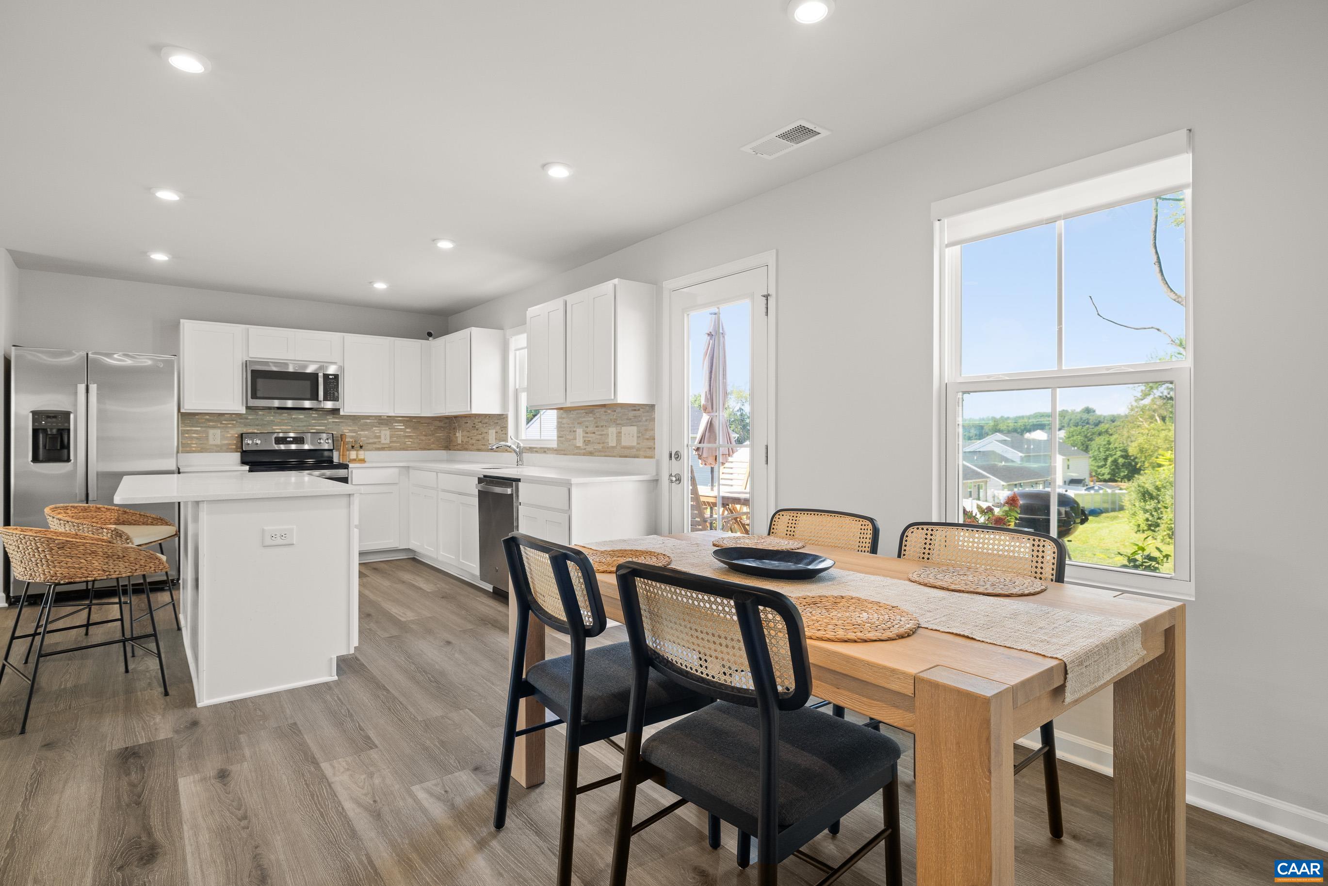 132 White Birch Road Waynesboro, VA 22980 - Photo 16 of 47 a kitchen with granite countertop white cabinets and stainless steel appliances