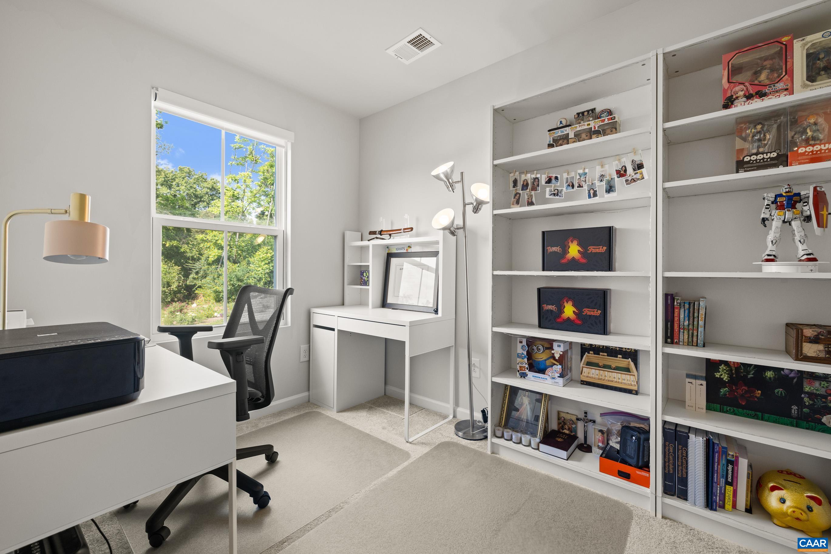 132 White Birch Road Waynesboro, VA 22980 - Photo 18 of 47 a view of a workspace with furniture and a bookshelf