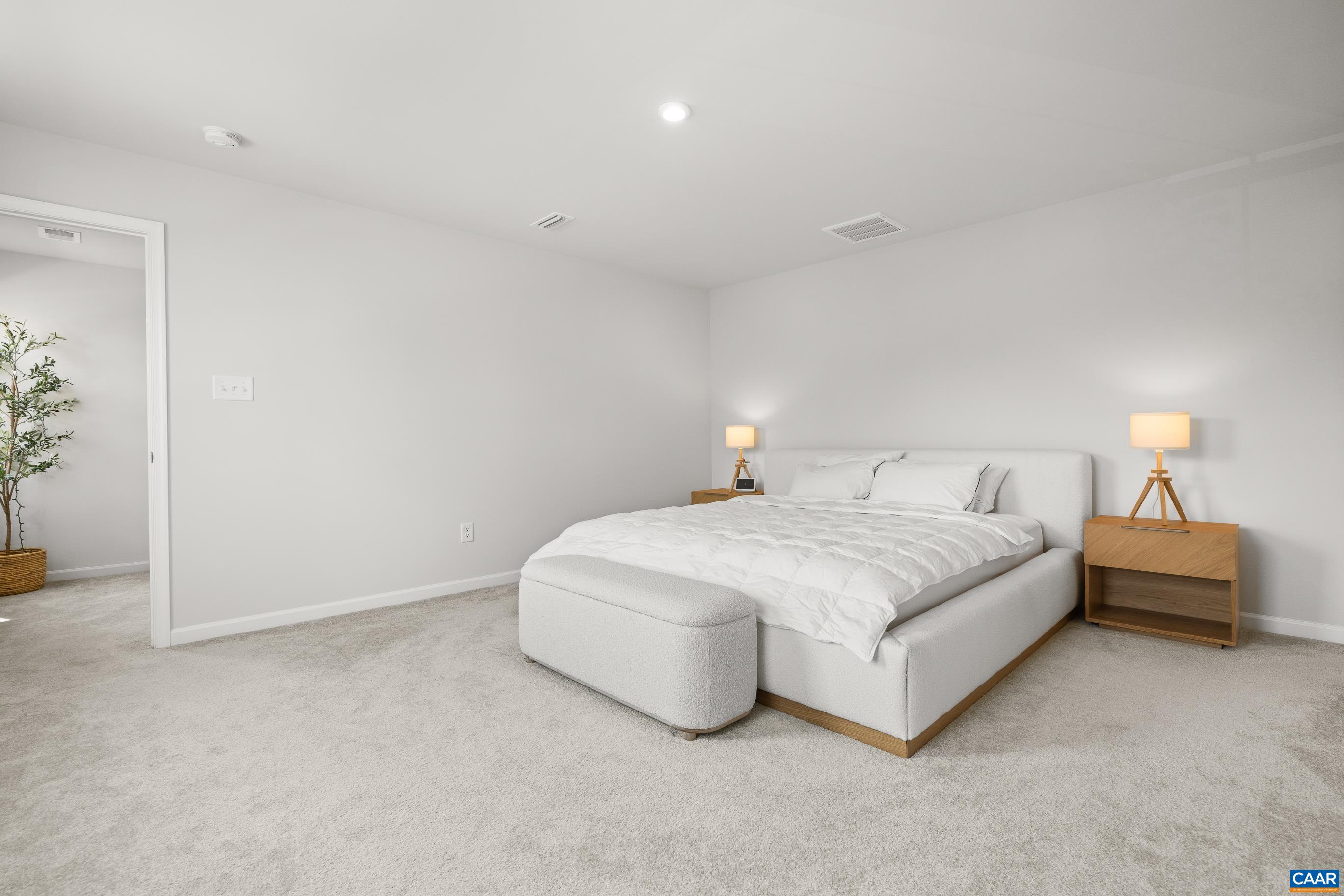 132 White Birch Road Waynesboro, VA 22980 - Photo 24 of 47 a spacious bedroom with a bed and a lamp