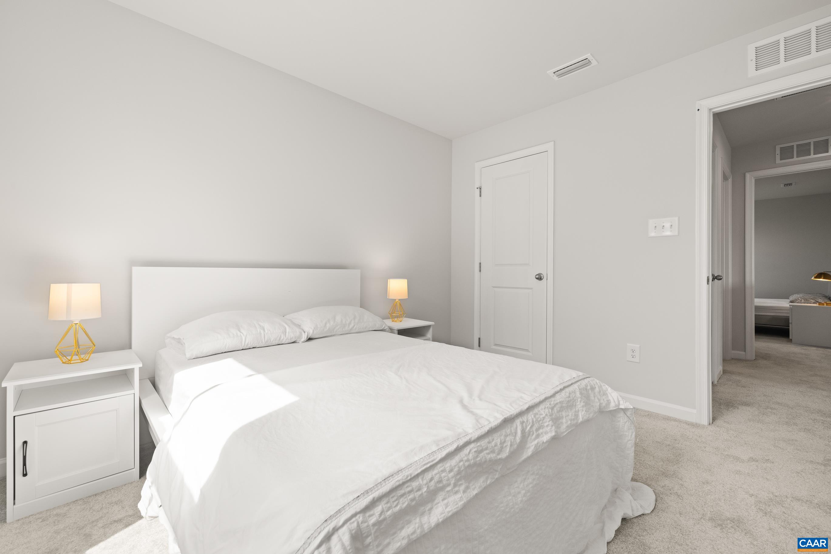 132 White Birch Road Waynesboro, VA 22980 - Photo 32 of 47 a bedroom with a bed and a lamp