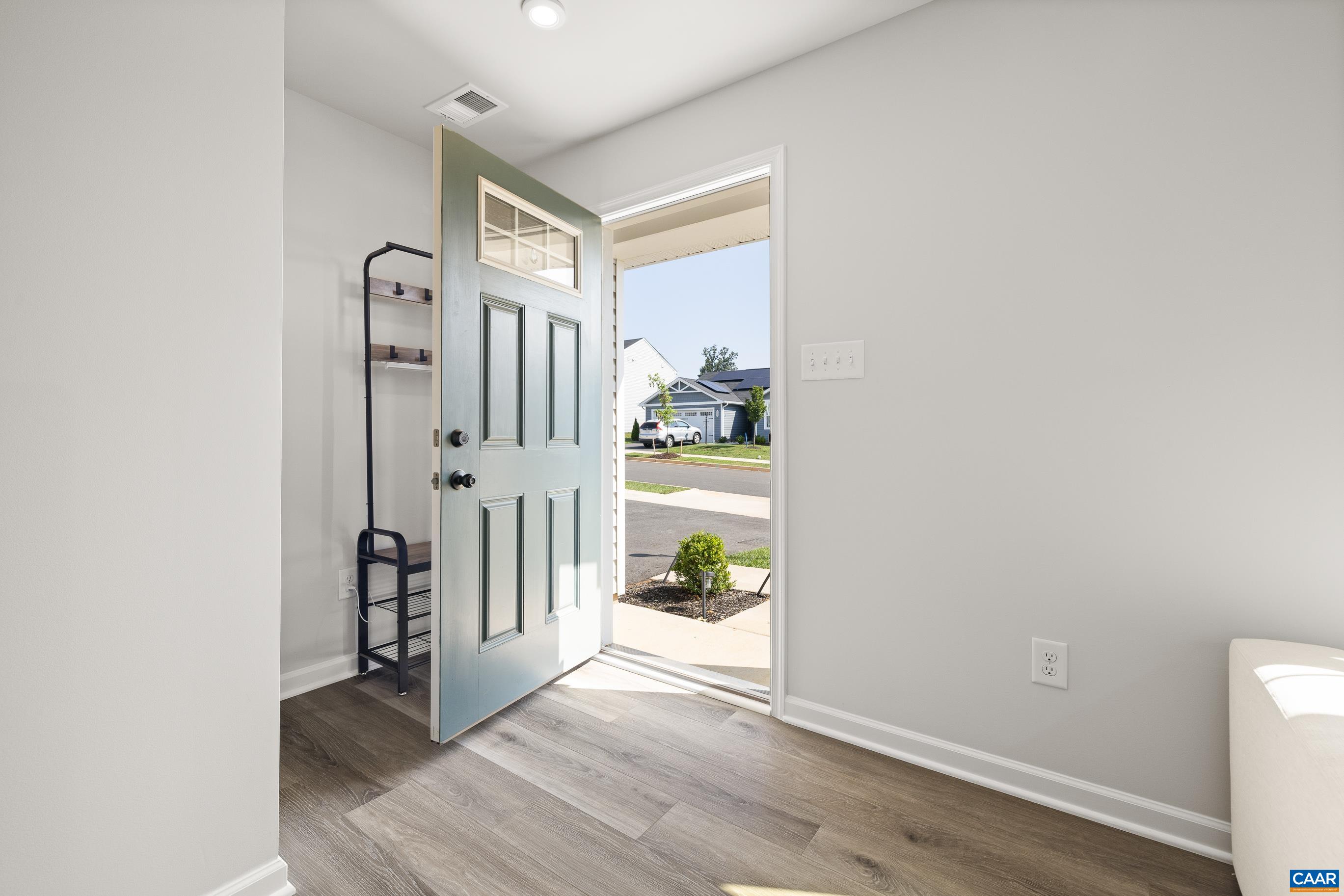 132 White Birch Road Waynesboro, VA 22980 - Photo 4 of 47 a view of a hallway with wooden floor and a living room