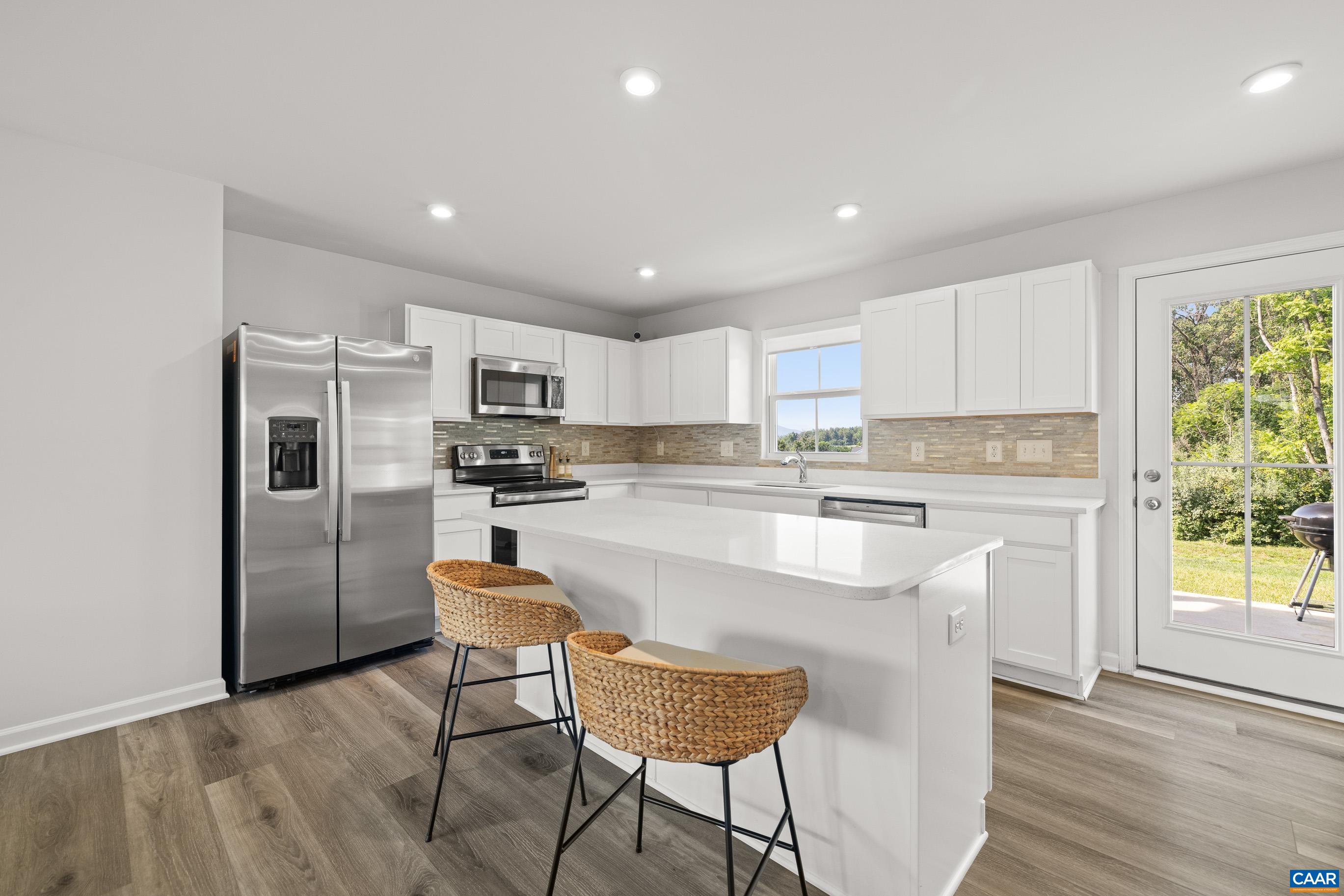 132 White Birch Road Waynesboro, VA 22980 - Photo 9 of 47 a kitchen with kitchen island white cabinets and stainless steel appliances