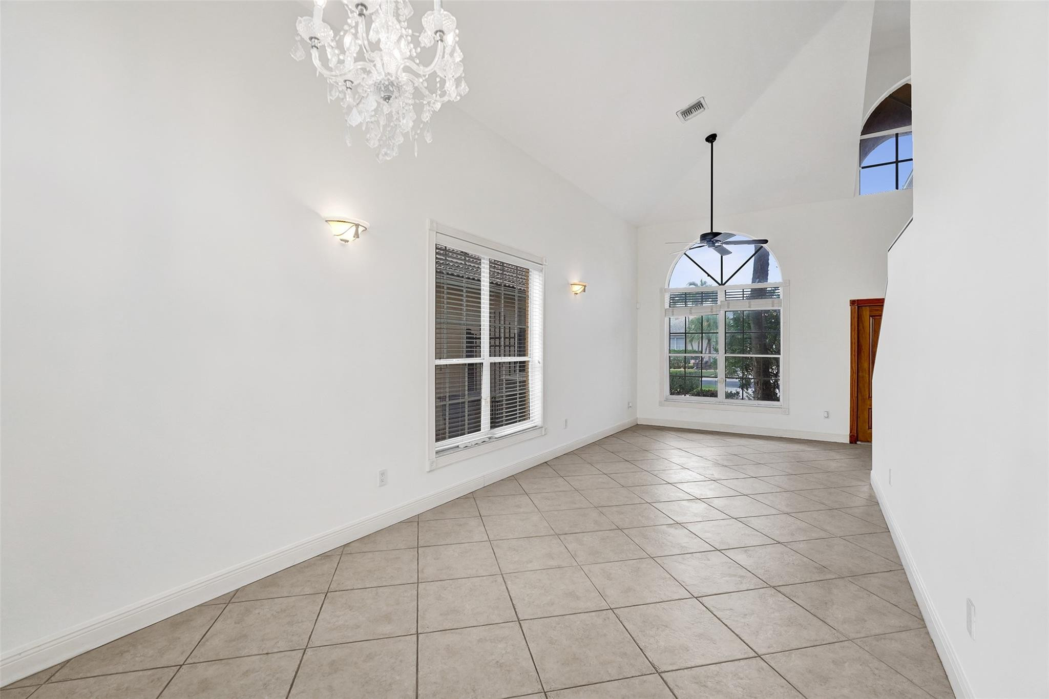 10902 Tamoron Lane Boca Raton, FL 33498 - Photo 9 of 66 a view of an empty room with a window