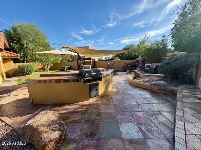 a view of a swimming pool with a patio