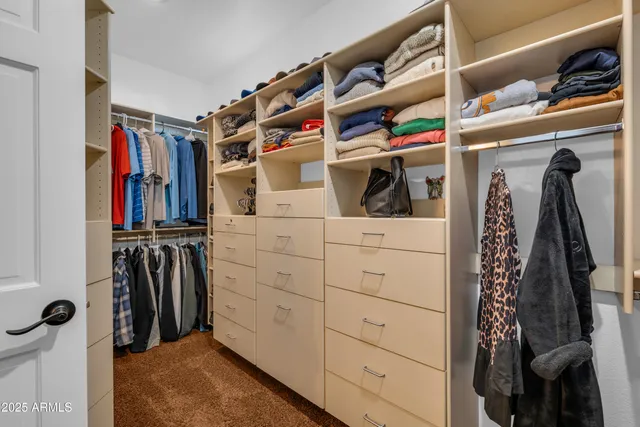 a bathroom with a granite countertop toilet a sink and a mirror