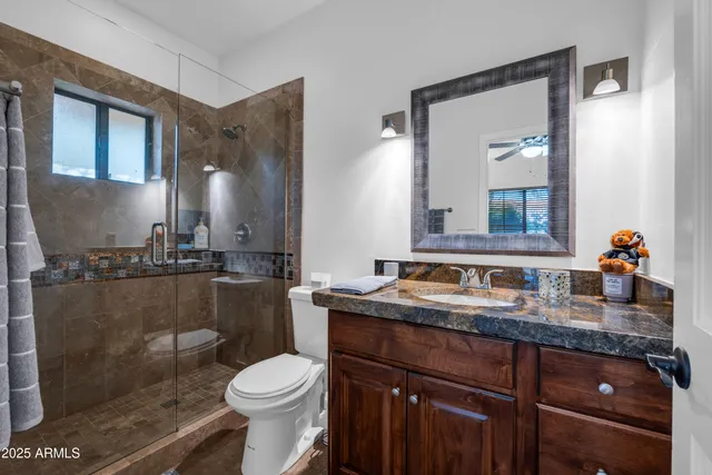 a bedroom with bunk bed and a window