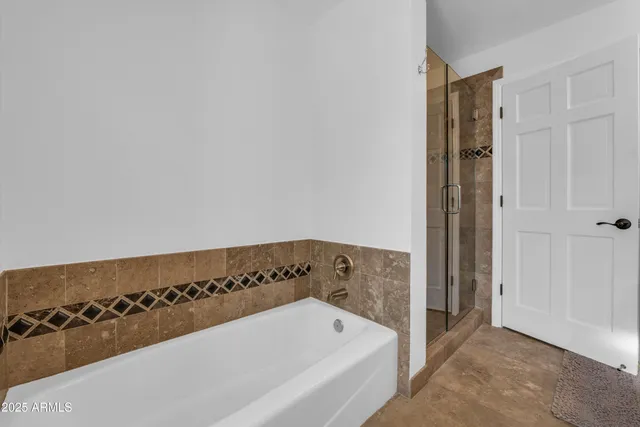 a view of a house with a backyard and a tree