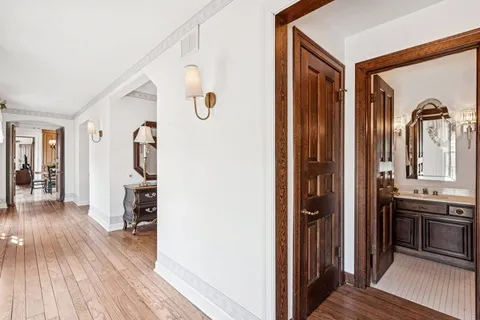 a view of entryway and hall with wooden floor