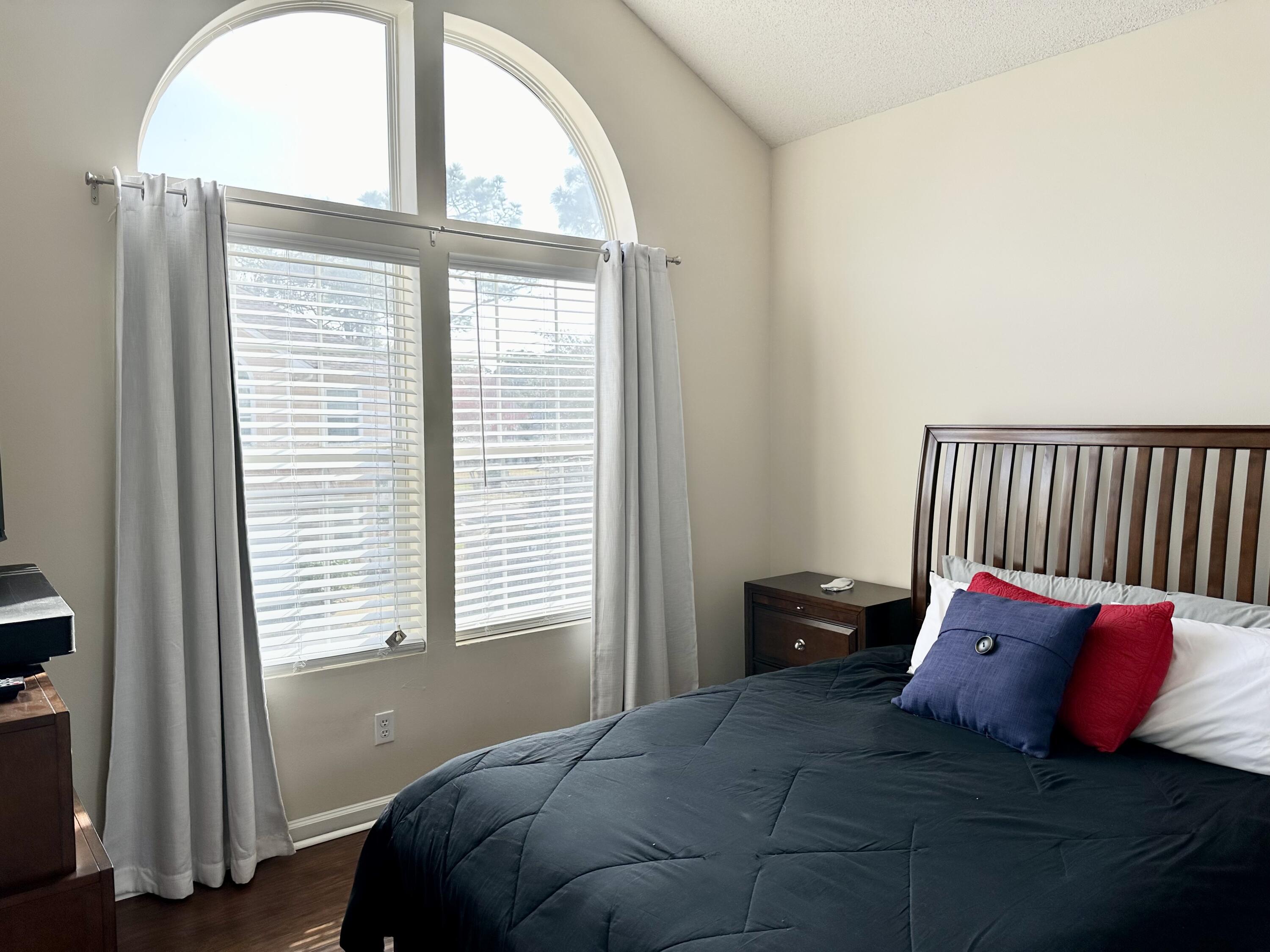 732 East Mack Bayou Drive, Unit 2 Santa Rosa Beach, FL 32459 - Photo 28 of 43 a bed sitting in a bedroom next to a window