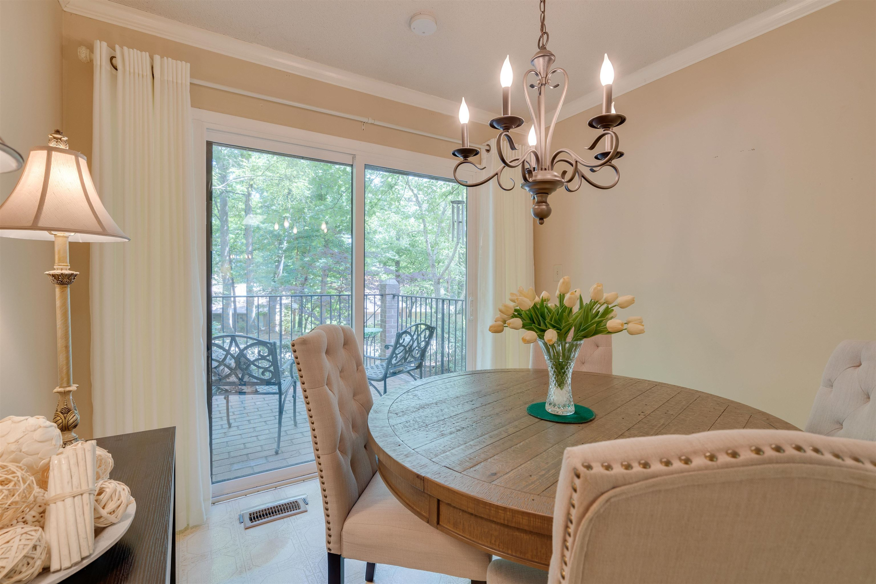1 Pinnacle Road Durham, NC 27705 - Photo 12 of 38 a dining room with furniture a chandelier and a rug