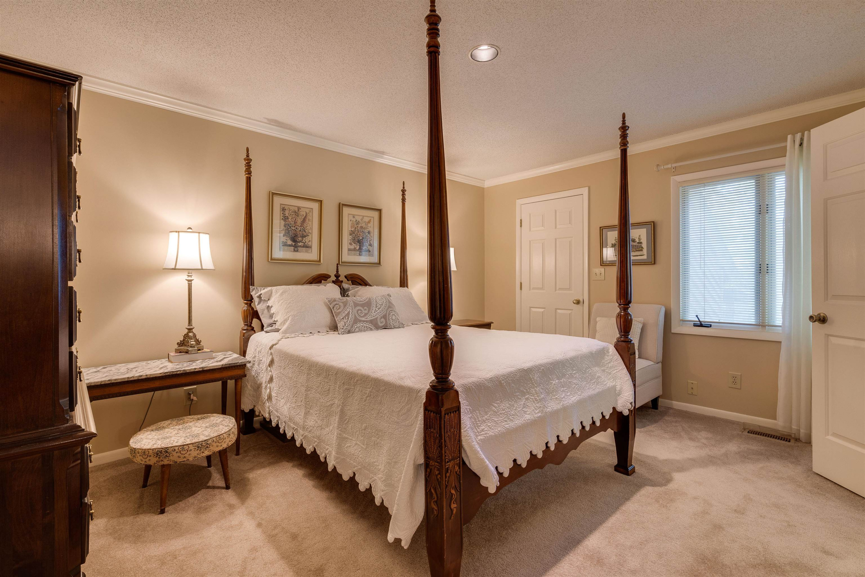 1 Pinnacle Road Durham, NC 27705 - Photo 20 of 38 a bedroom with a bed lamps and a large mirror