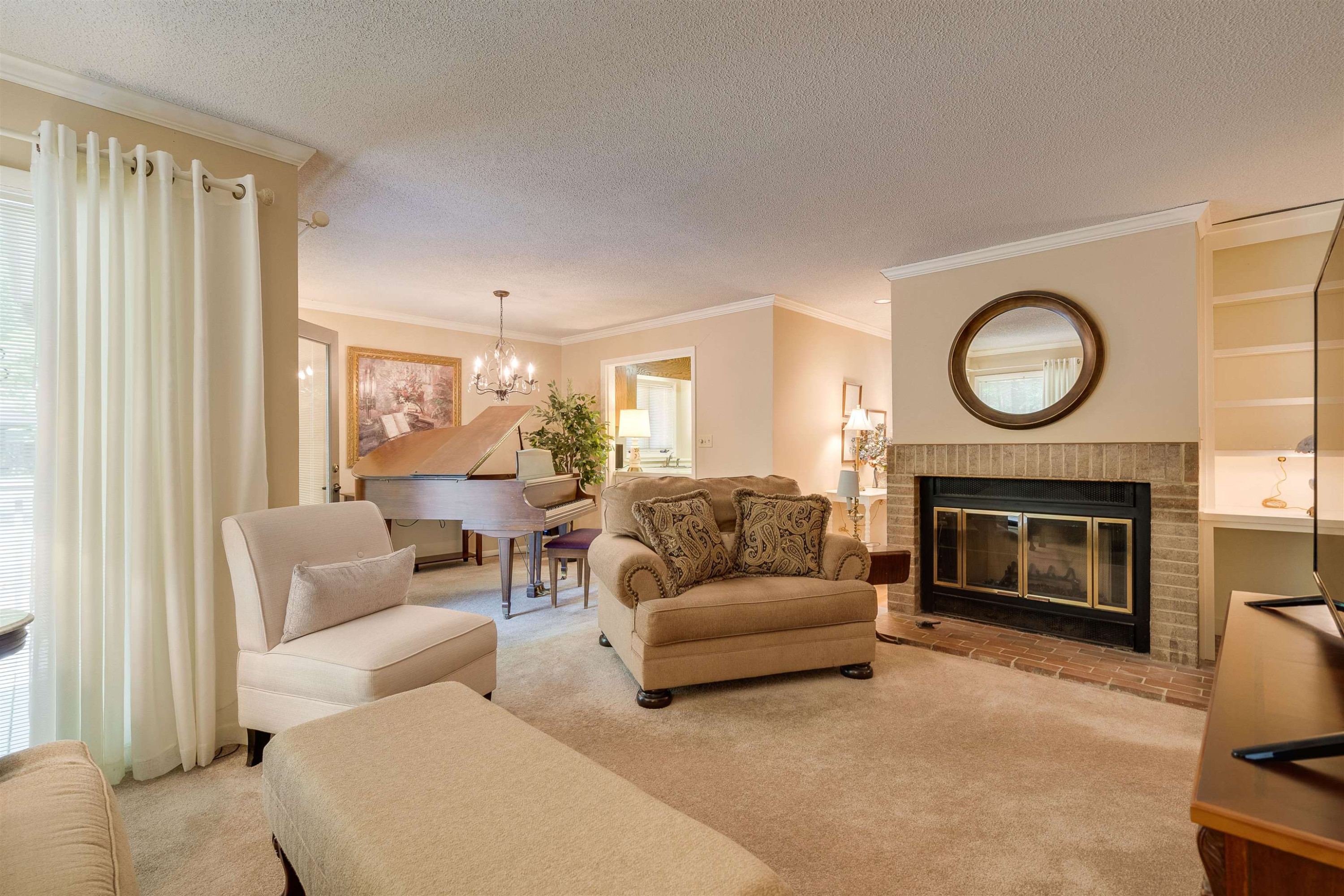 1 Pinnacle Road Durham, NC 27705 - Photo 7 of 38 a living room with furniture and a fireplace