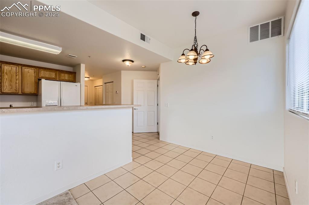 3755 Hartsock Lane, Unit 203 Colorado Springs, CO 80917 - Photo 18 of 43 a view of a kitchen with granite countertop cabinets