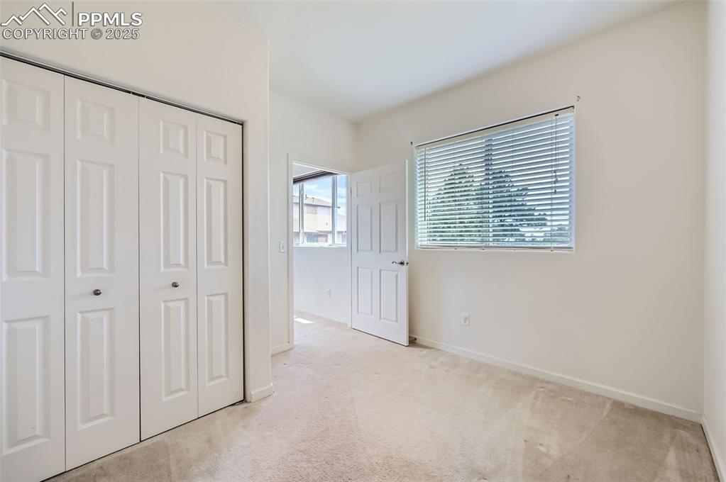 3755 Hartsock Lane, Unit 203 Colorado Springs, CO 80917 - Photo 27 of 43 an empty room with windows