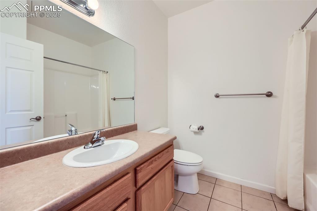 3755 Hartsock Lane, Unit 203 Colorado Springs, CO 80917 - Photo 30 of 43 a bathroom with a sink toilet and a mirror