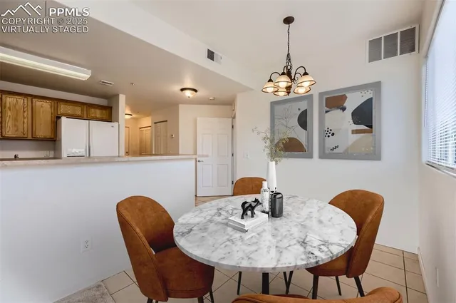 a dining room with furniture and window