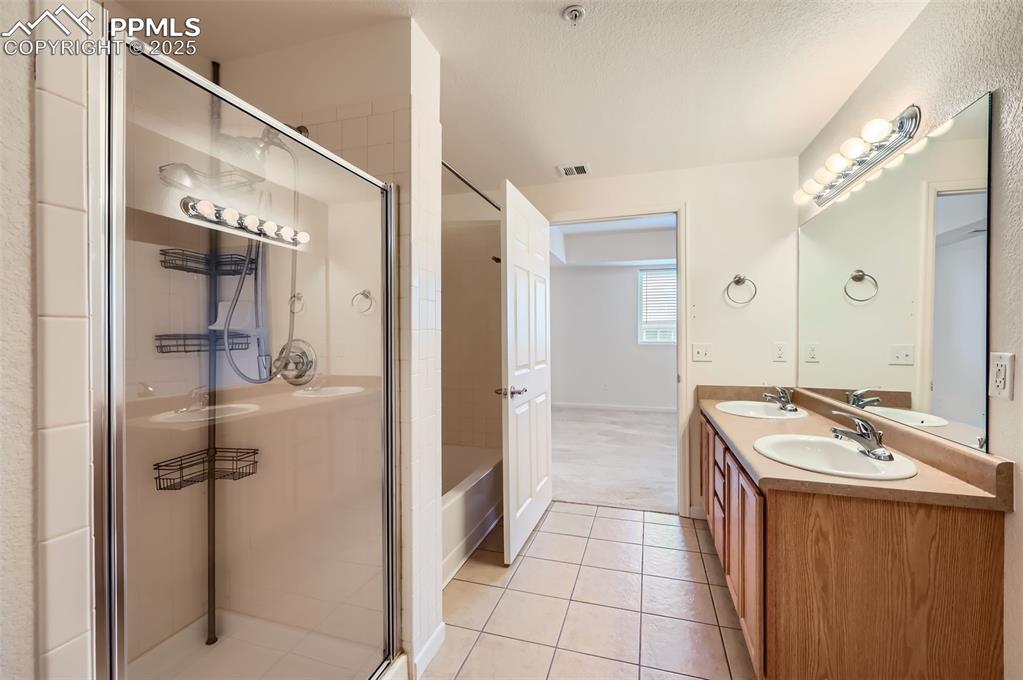 3755 Hartsock Lane, Unit 203 Colorado Springs, CO 80917 - Photo 8 of 43 a room with a mirror and a sink