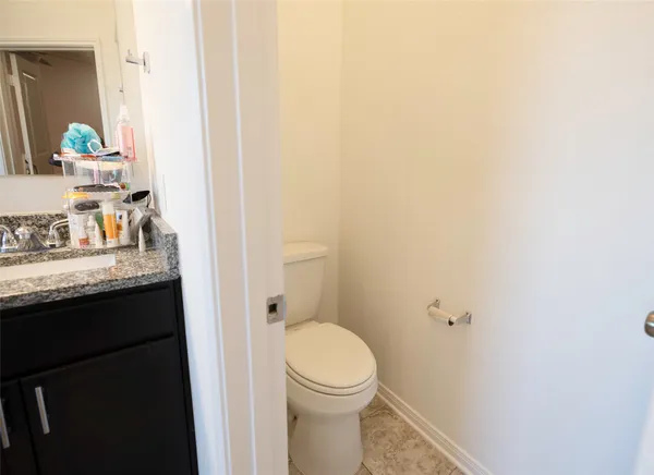 a spacious bathroom with a tub sink and mirror