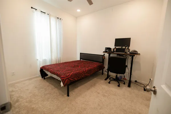 a bedroom with a bed and a table